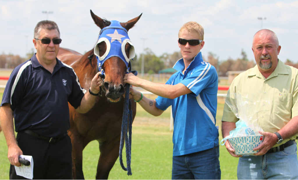 The 1000m Class 3 Plate winner Shagsine, ridden by Adrian Coome, with trainer Todd Austin (far right) at Pioneer Park in Emerald on Saturday. The 1000m Class 3 Plate winner Shagsine, ridden by Adrian Coome, with trainer Todd Austin (far right) at Pioneer Park in Emerald on Saturday.